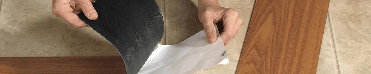 A professional installing vinyl flooring in Boca Raton, FL